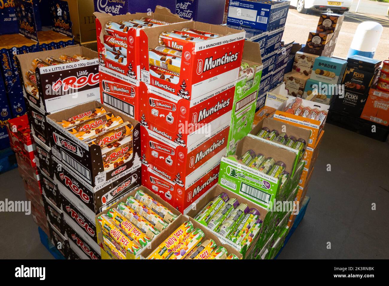 Variety of christmas sweets in tubes on a pallet in a supermarket in Norfolk Stock Photo
