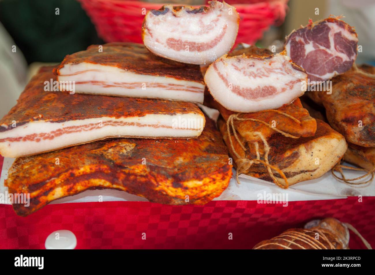 Some types of cured meats on display at the Salone del Gusto in Turin Stock Photo