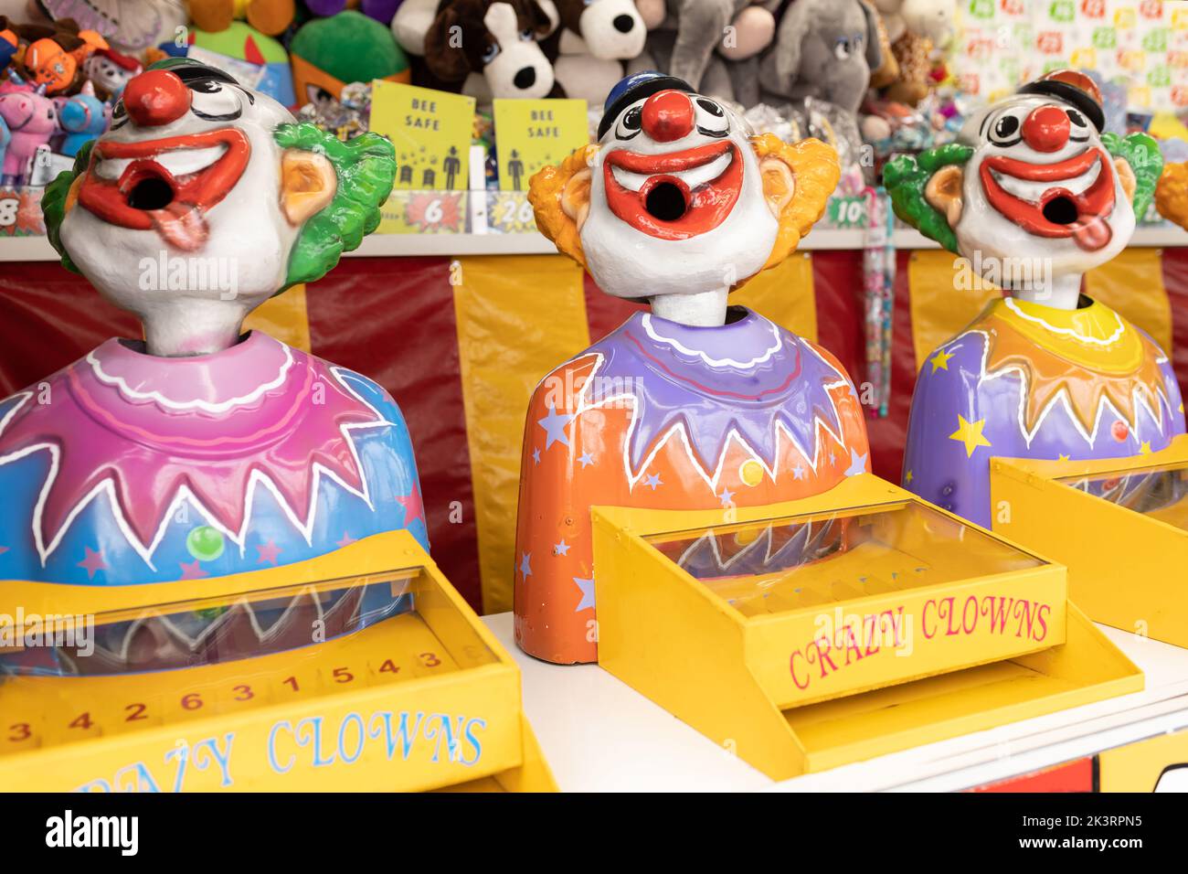 Laughing clowns game attraction at a fair carnival Stock Photo - Alamy