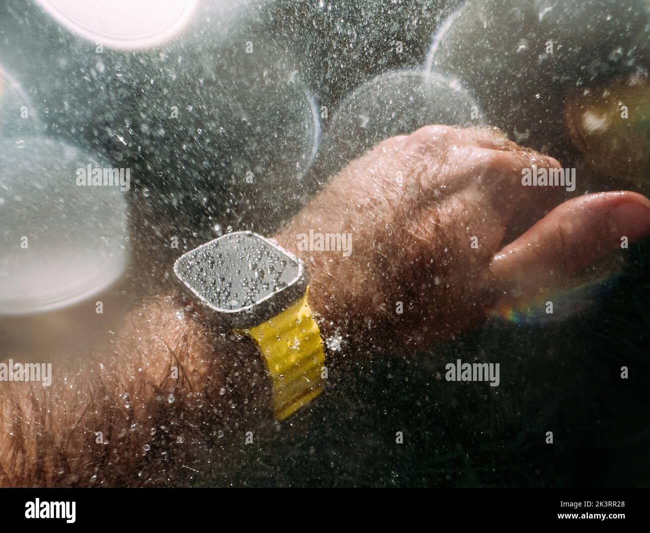Paris, France - Sep 23, 2022: Male hand underwater diving swimming with new titanium Apple Watch Ultra designed for extreme activities like endurance sports, elite athletes, trailblazing, adventure Stock Photo