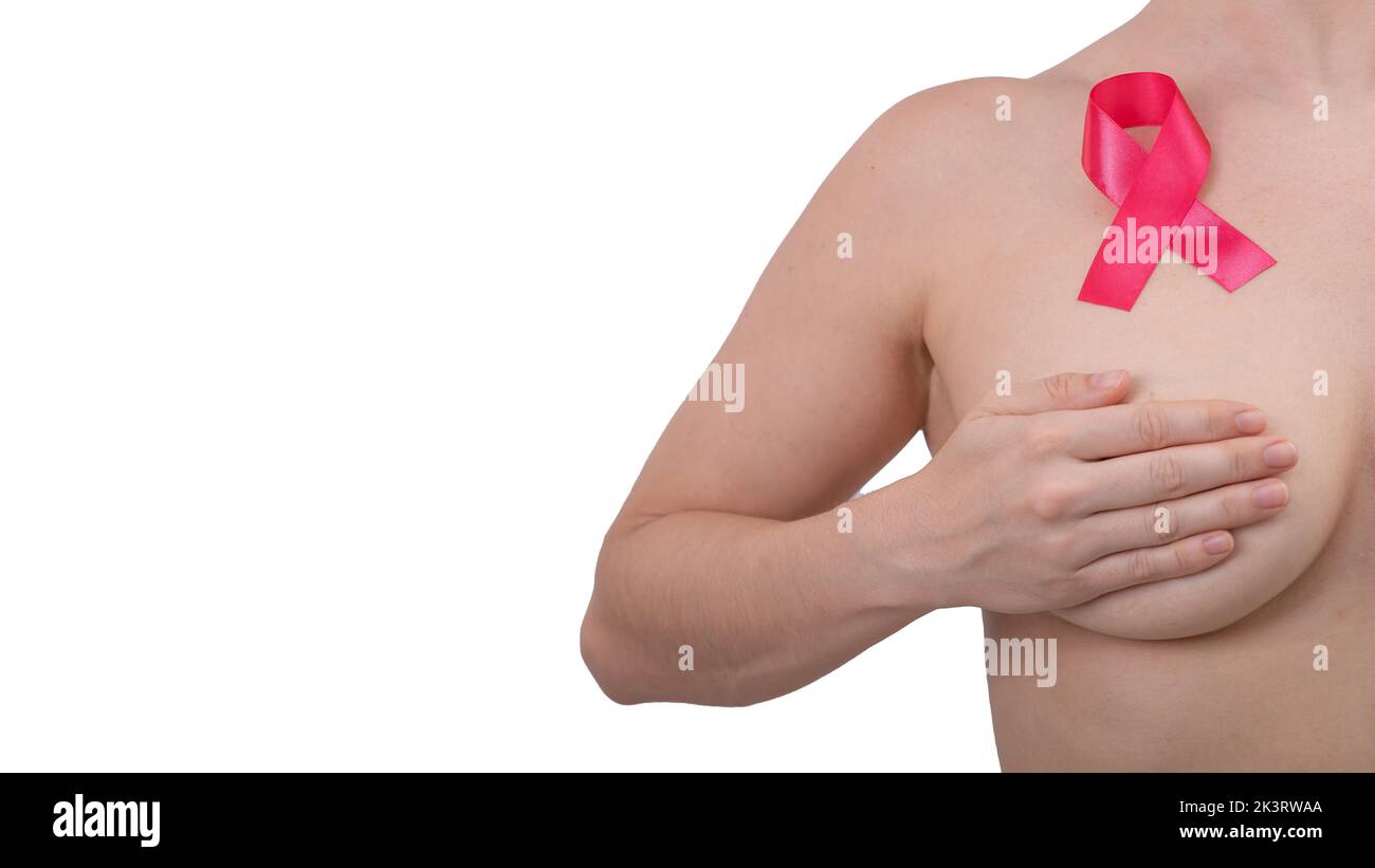 Caucasian woman covers her chest with her hands on a white background