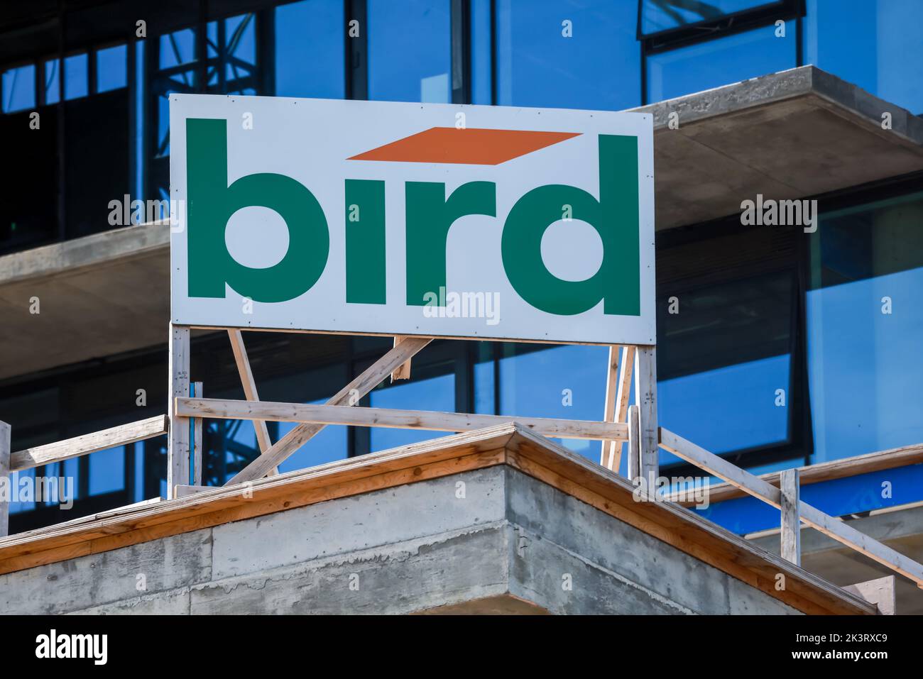 Bird Construction Company banner at high rise building construction location. A 100 year old company. HALIFAX, NOVA SCOTIA, CANADA - SEP 2022 Stock Photo