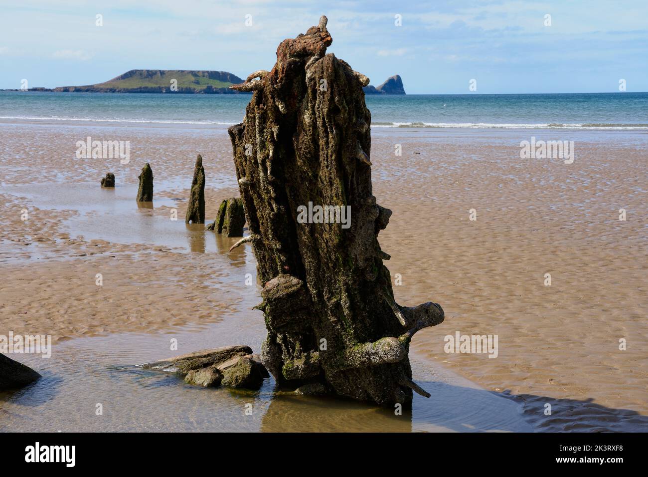 Low tide on Rhossili beach reveals the decaying remains of the sailing