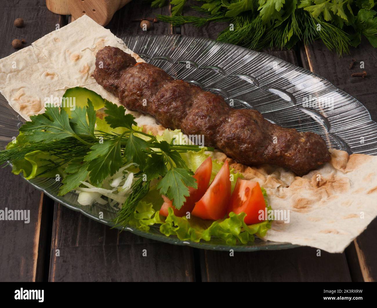 tasty Lula beef kebab with vegetables on pita bread Stock Photo Alamy