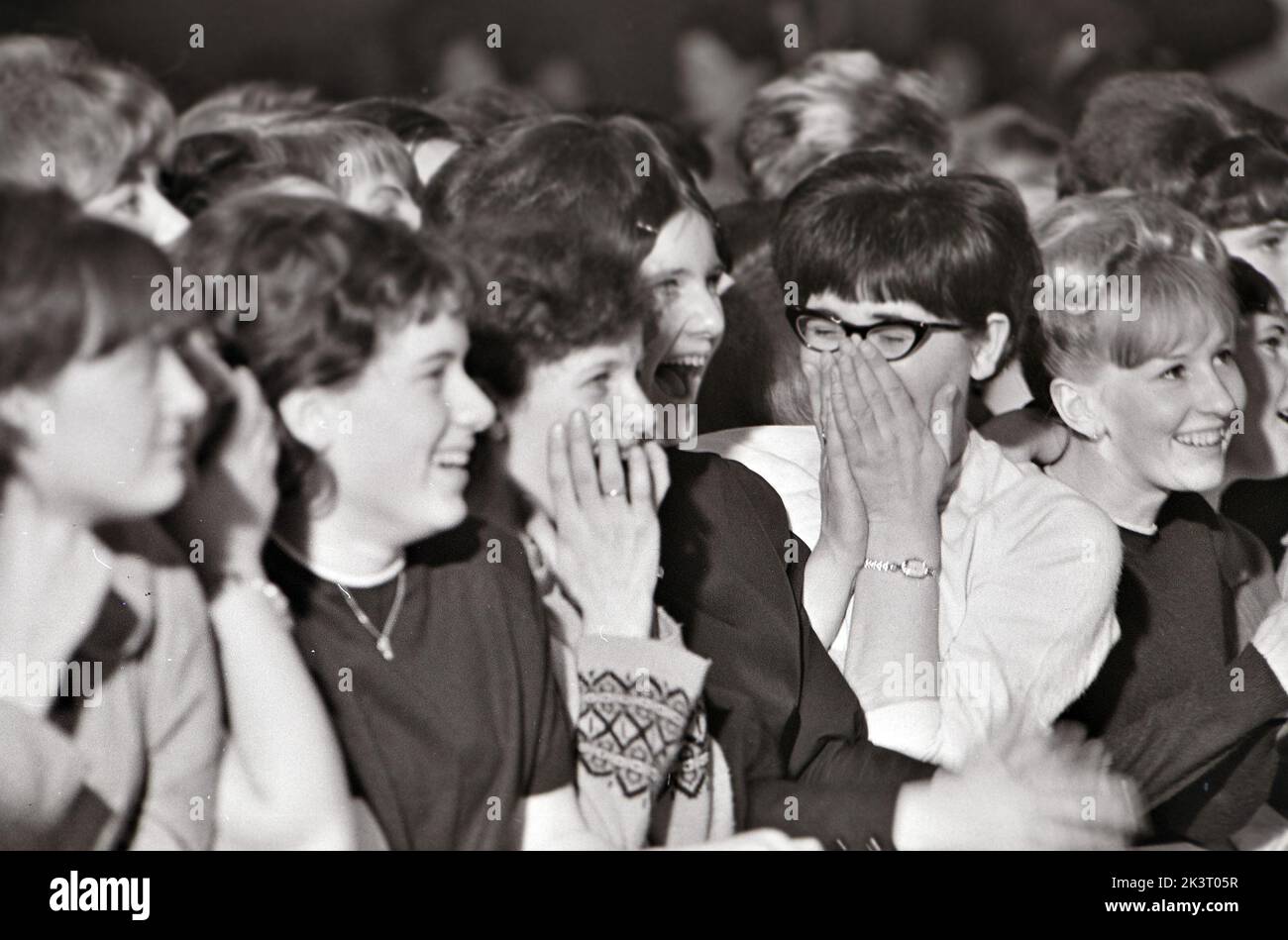 TEENAGERS at the Royal, Tottenham, London, in January 1964 watching the Dave Clark Five pop group. Photo: Tony Gale Stock Photo