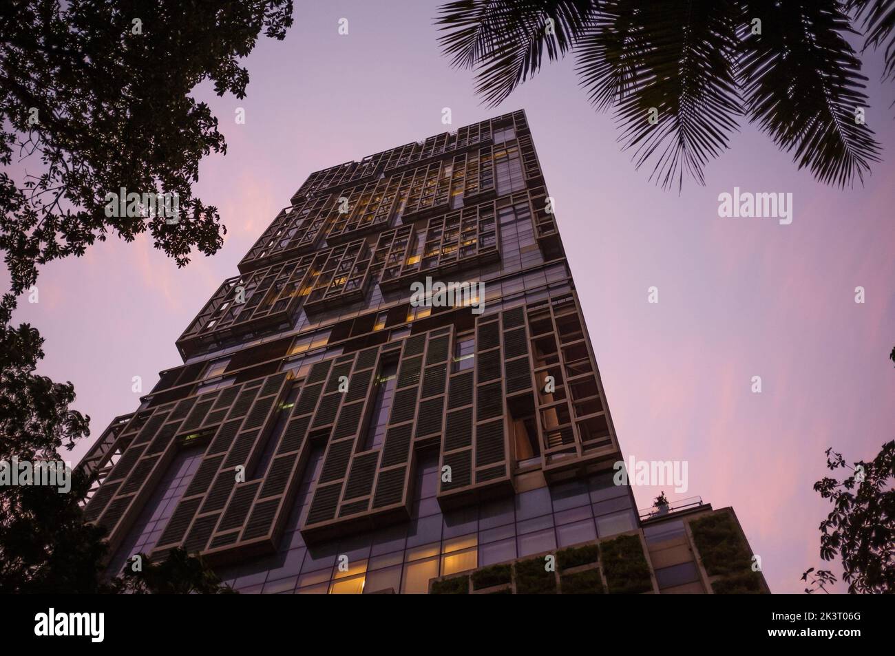 A low angle shot of the Antilia Ambani house in Mumbai at the purple sunset Stock Photo