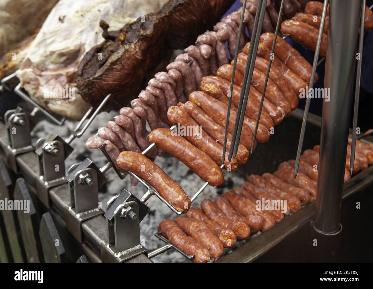 Frying sausage in pan, fast food and restaurant Stock Photo