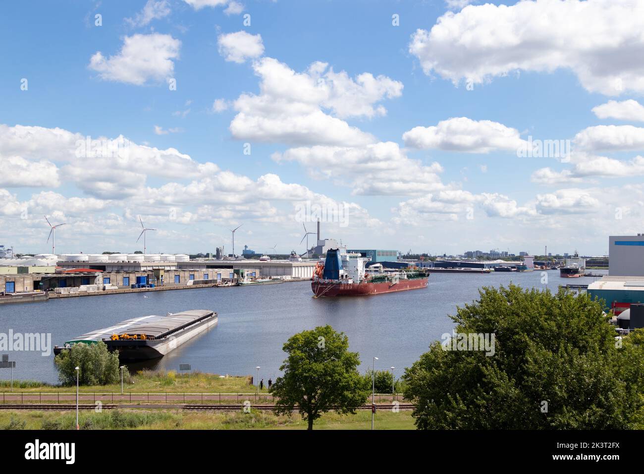 An aerial view of ships and wind turbines on the harbor of Amsterdam ...