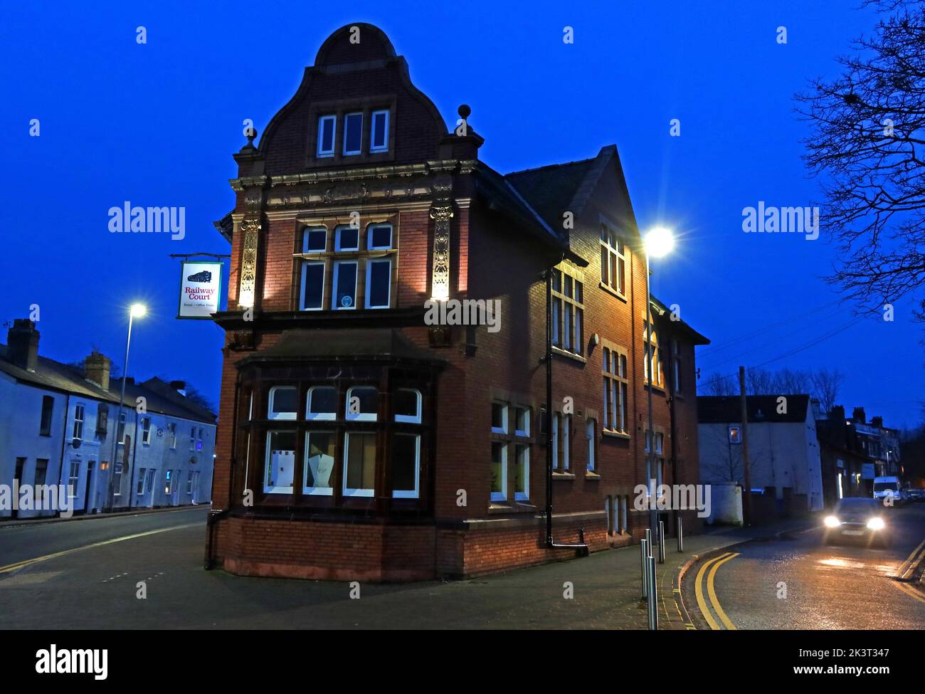 ex-Railway Hotel, 686 Knutsford Road, Latchford village, Warrington, Cheshire, England, UK, WA4 1JW, now Railway Court at dusk Stock Photo