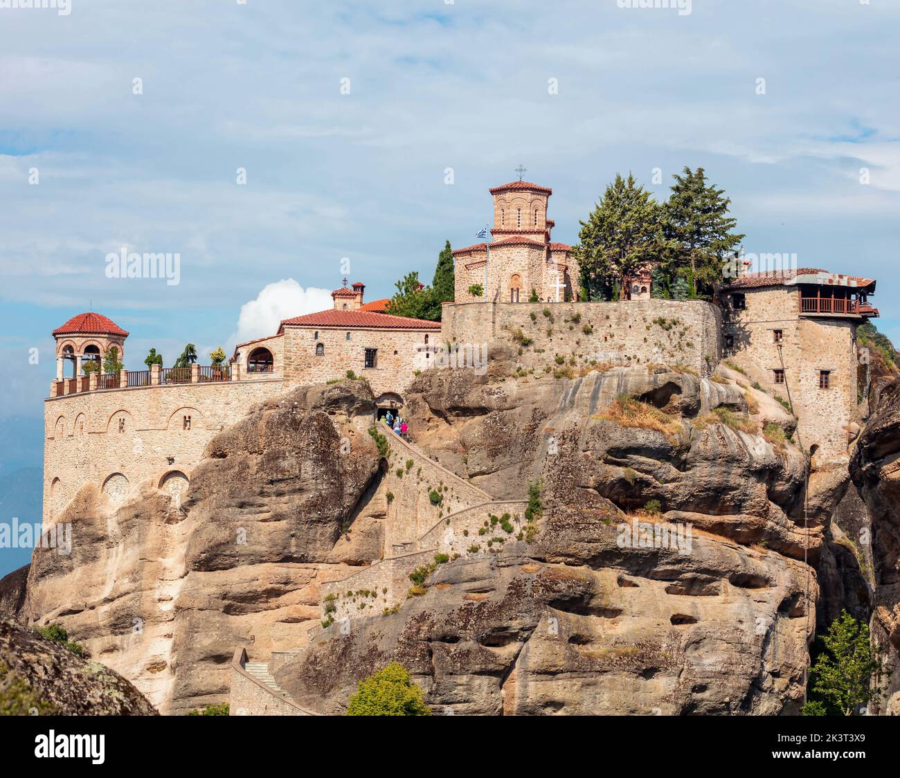 Meteora Greece. Varlaam Holy Monastery buildings on top of rocks, blue cloudy sky, close up view. Europe religion travel destination Stock Photo