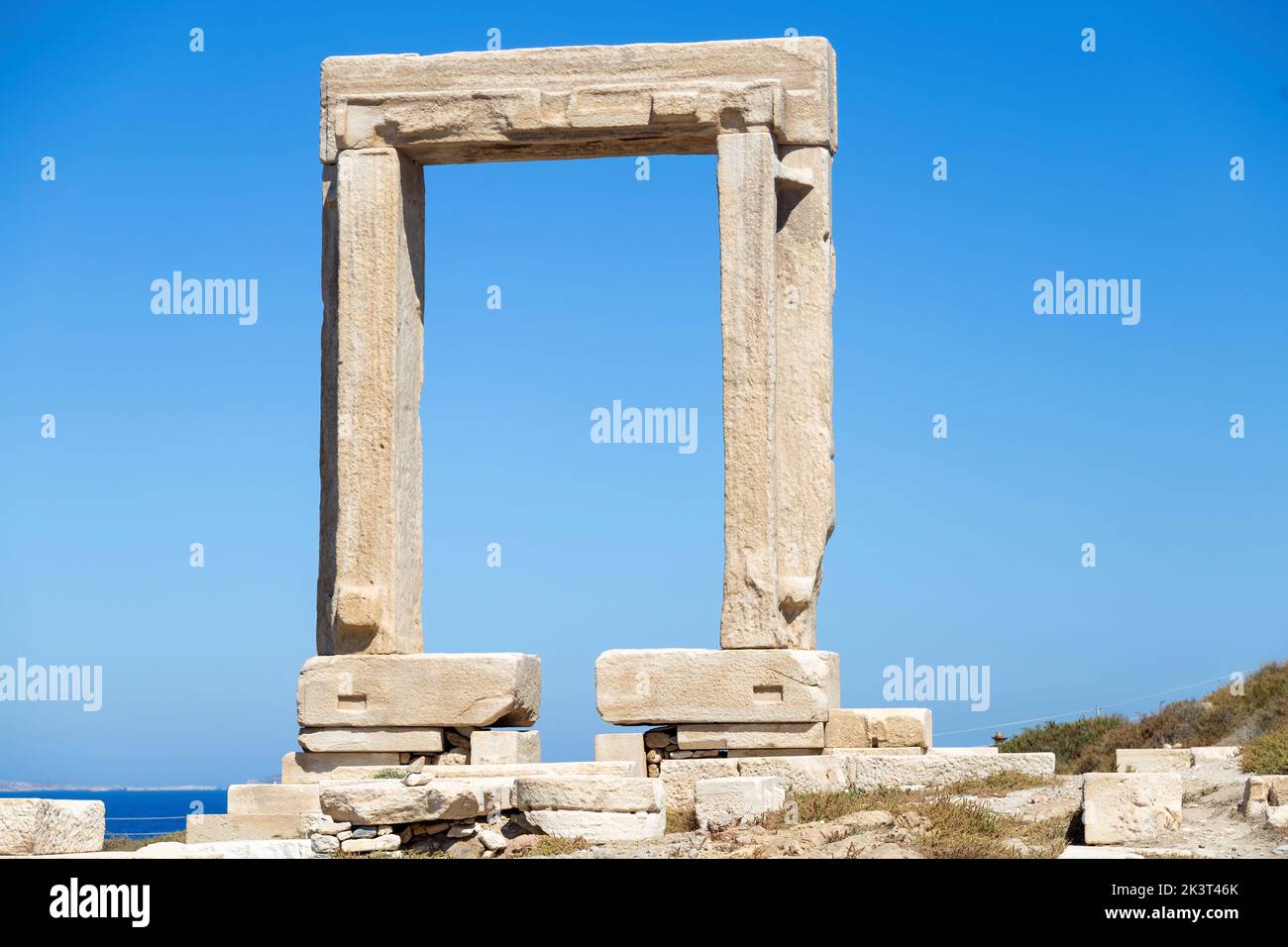 Naxos island, Greece. Temple of Apollo, Cyclades. Portara, marble gate front view. Summer archeology destination. Stock Photo