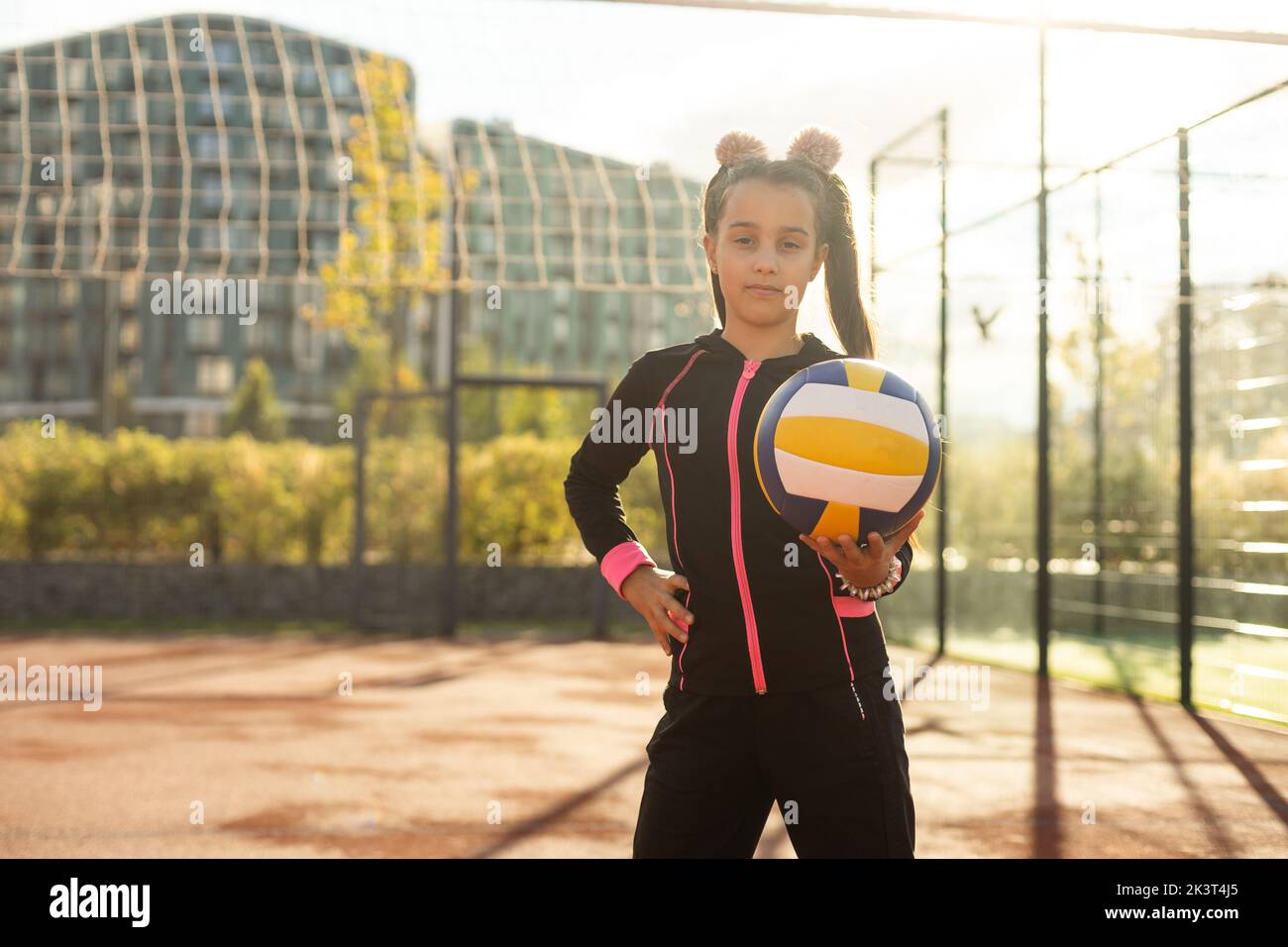 Pretty teen girl with brunette hair, volleyball ball Stock Photo - Alamy