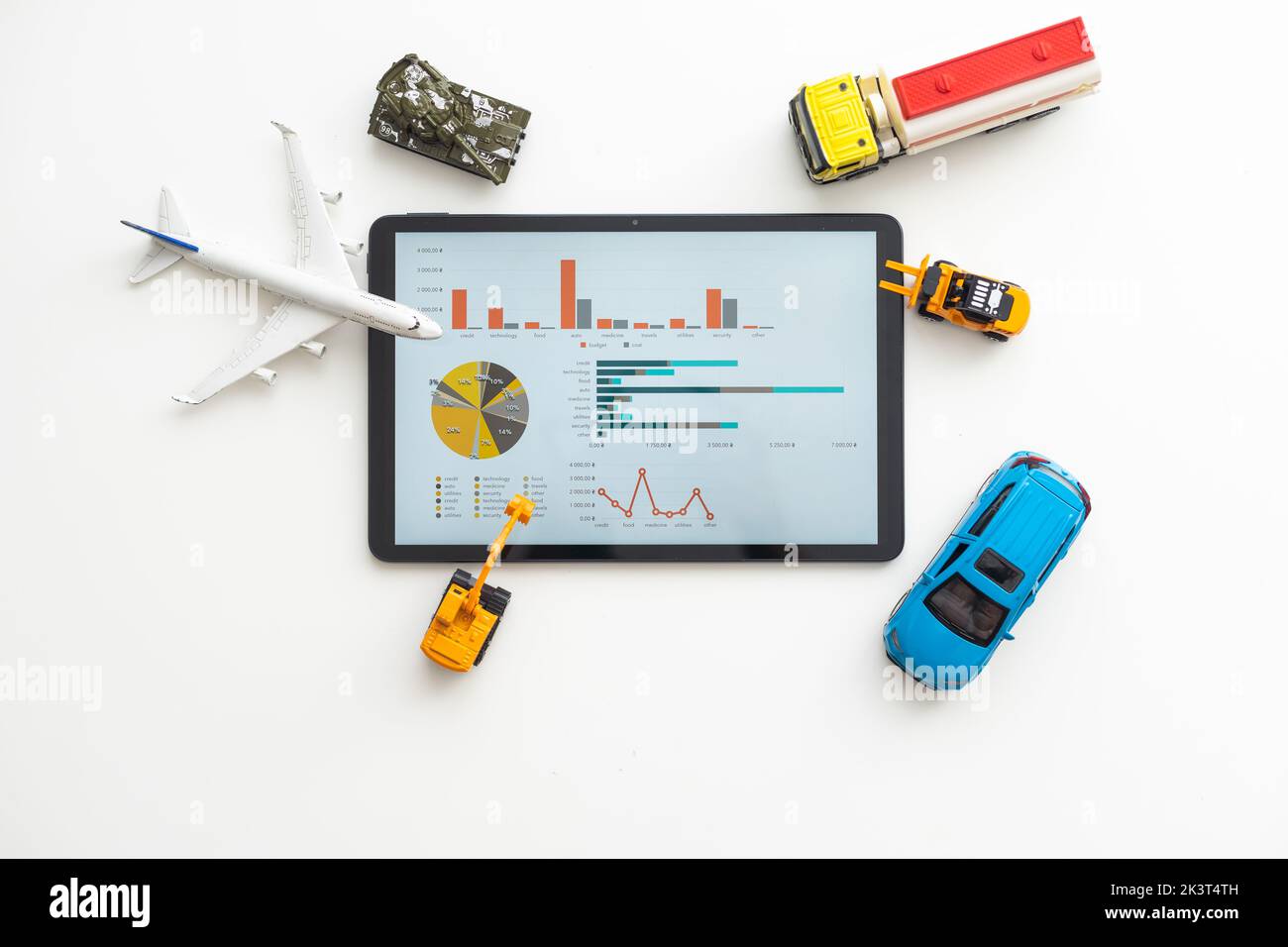Tablet computer with different types of toy transport Stock Photo