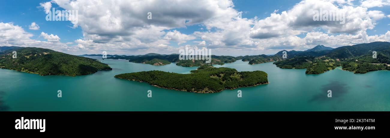 Plastiras Lake, Greece Panoramic aerial view, blue sky with clouds. Also called Tavropos Reservoir is an artificial lake fed by Megdovas river in Kard Stock Photo