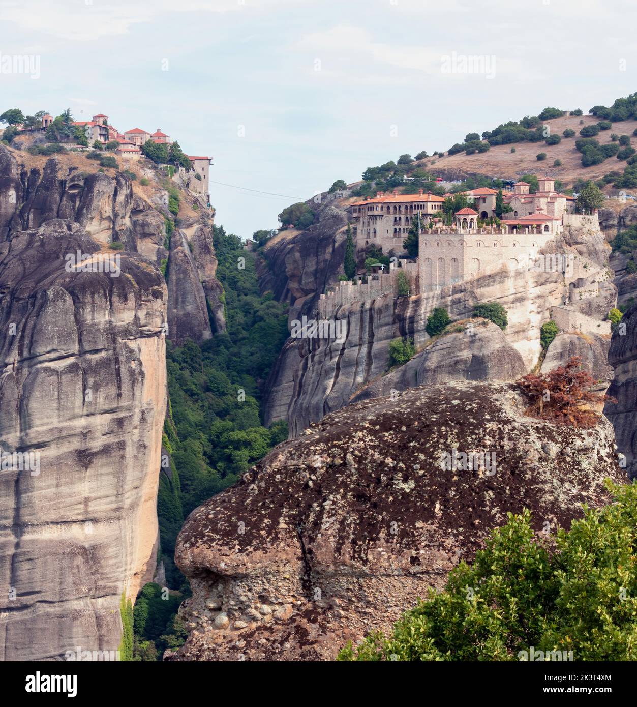 Meteora Greece. Varlaam and Great Megalo Meteoro Monastery. Blue sky over buildings on top of rocks. Europe travel destination Stock Photo