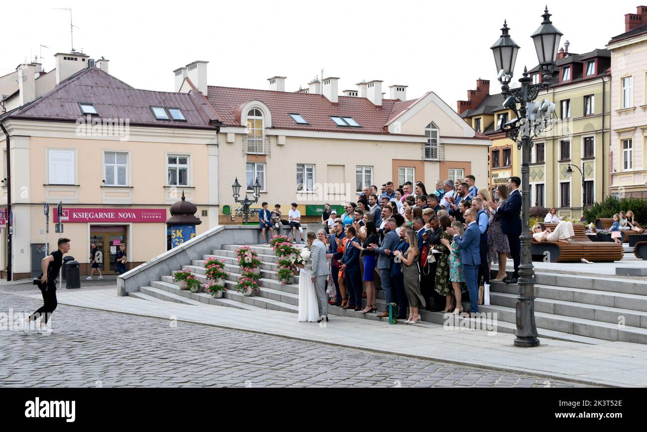 Wedding photography, on the steps, in the square. Stock Photo