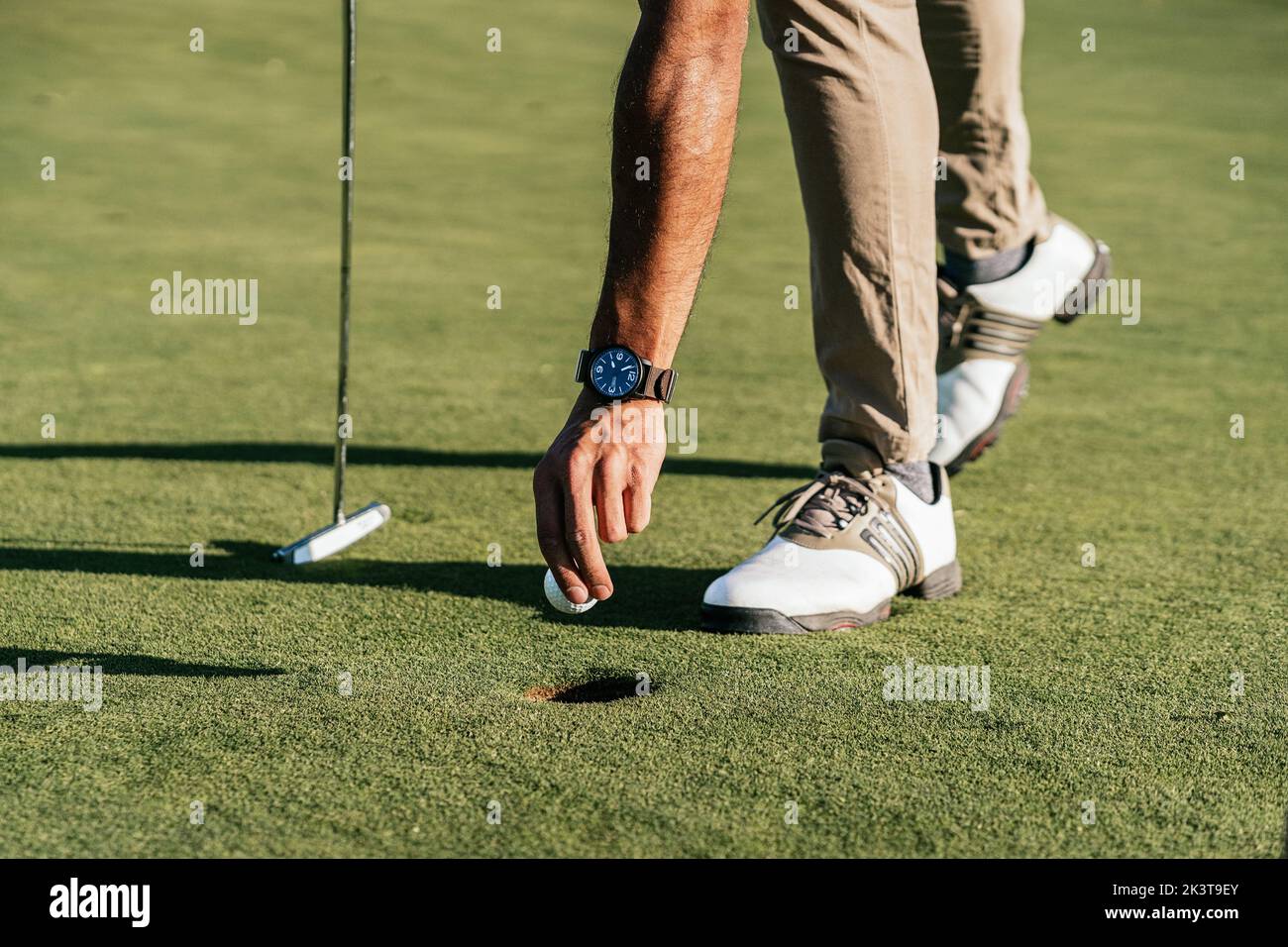 Leaning on putter hi-res stock photography and images - Alamy