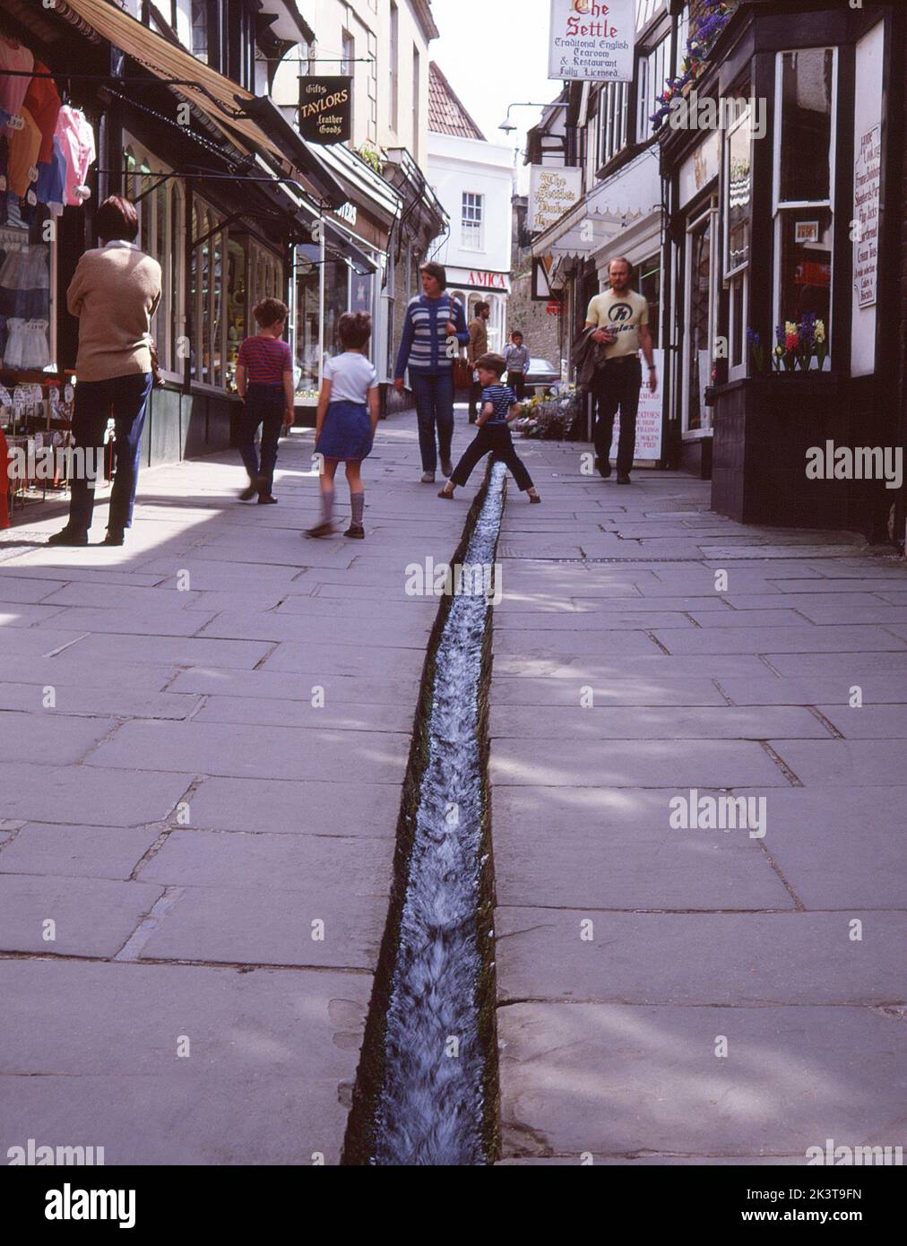Water drainage channel in town street, Frome, Somerset, UK Stock Photo