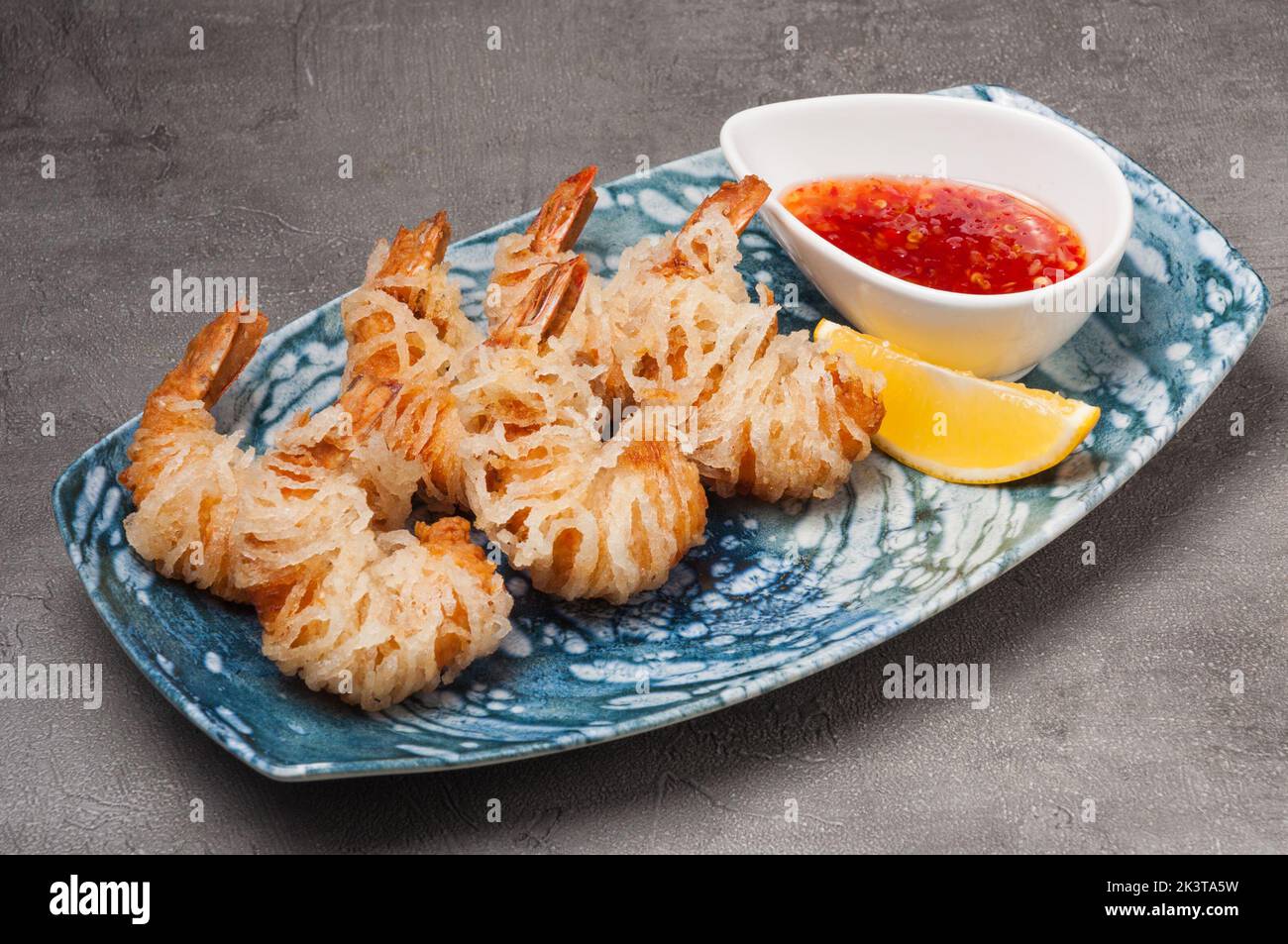 tasty shrimp fries in glass noodles with sweet and sour sauce Stock Photo