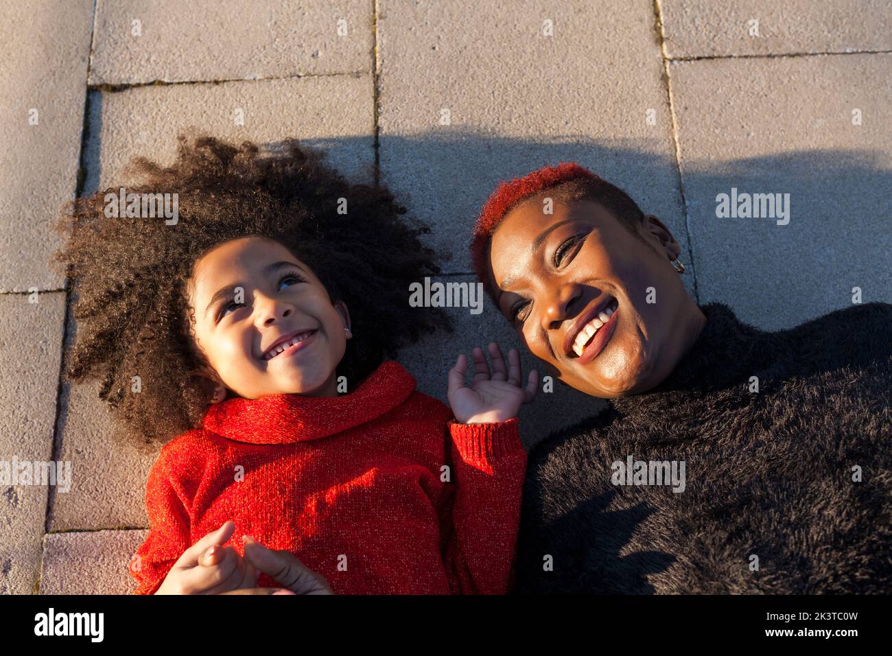 Brunette girl lying on floor hi-res stock photography and images - Alamy