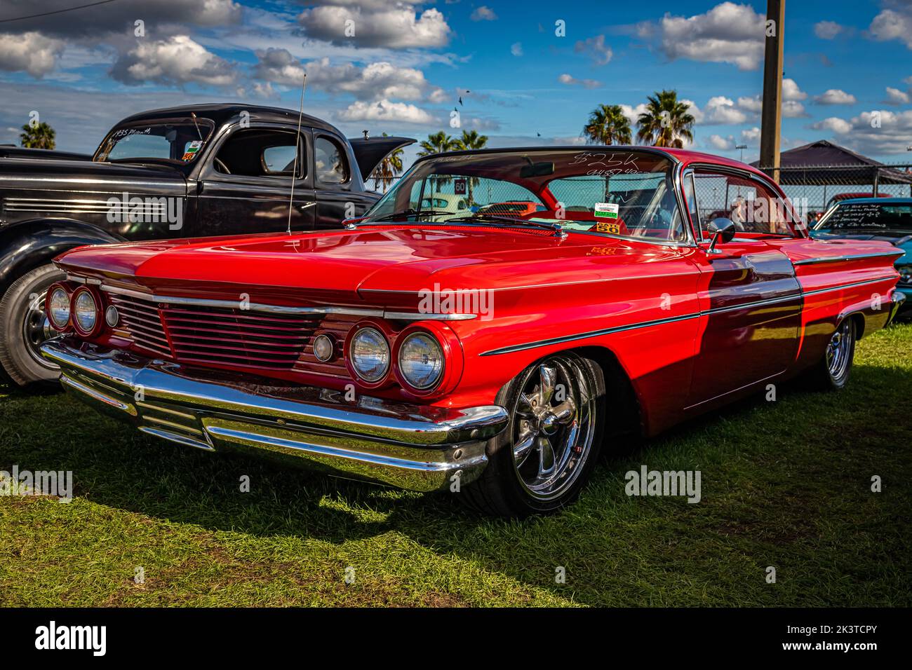 Daytona Beach, FL - November 28, 2020: Low perspective front corner view of a 1960 Pontiac Catalina Sport Coupe Hardtop at a local car show. Stock Photo