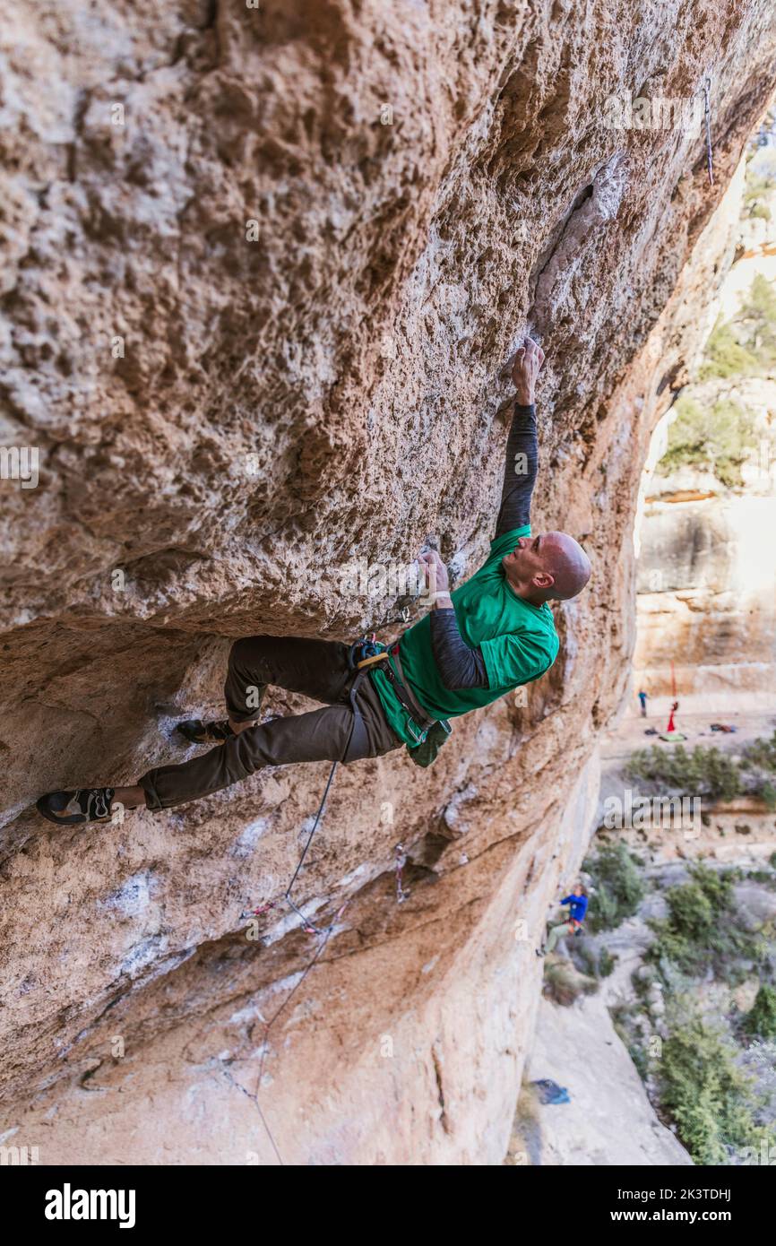 climber hanging on rope on rough cliff Stock Photo - Alamy