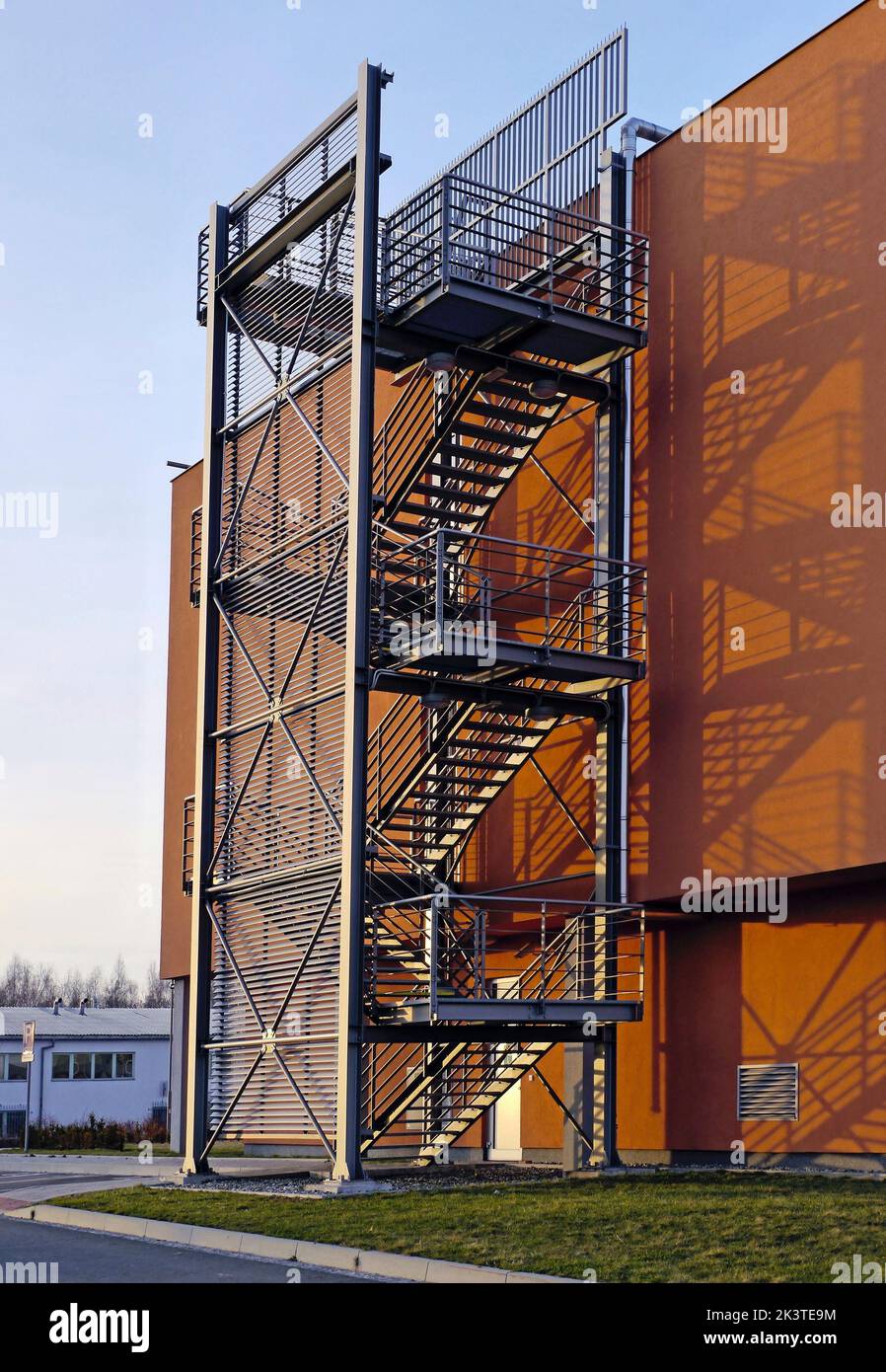 Steel emergency stairs on an orange commercial building Stock Photo - Alamy