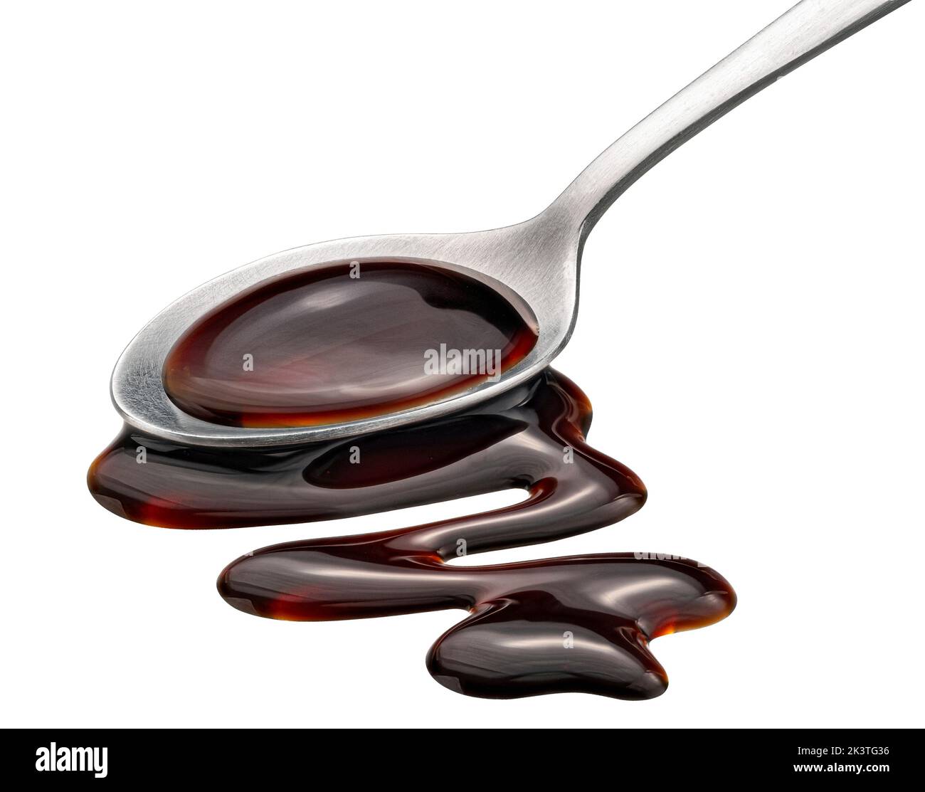 Balsamic sauce in spoon isolated on white background Stock Photo