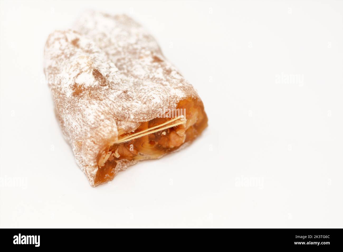 Arabian Egyptian taffy stuffed with walnuts, Eastern candy made as a