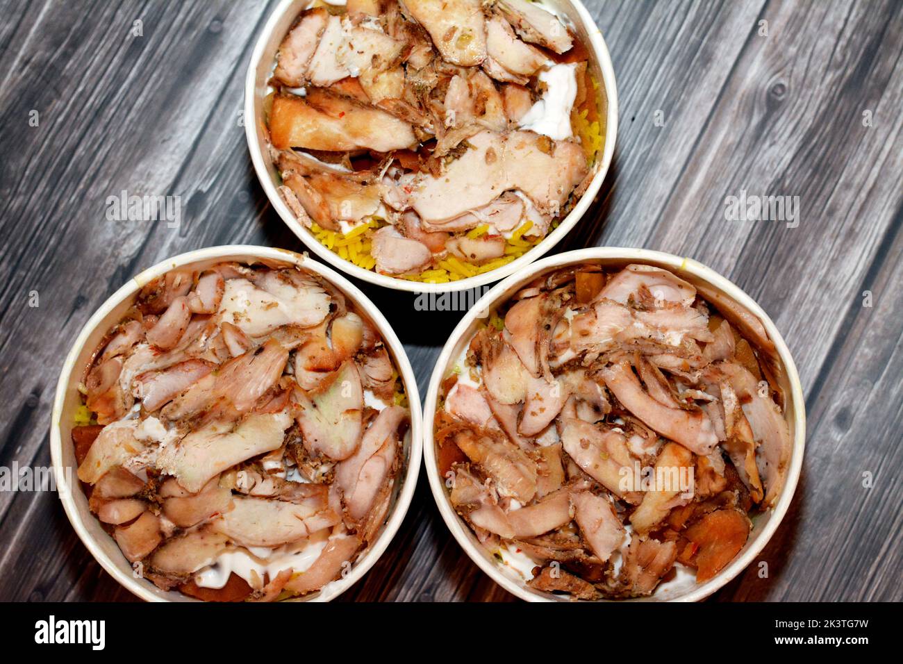 Pieces of Chicken shawarma with yellow Basmati rice, Syrian bread and