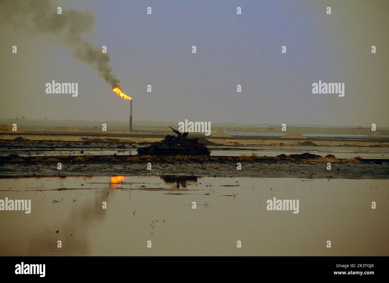 Burgan Oil Field Kuwait Oil Lake And Iraqi Tank And Flare Stock Photo