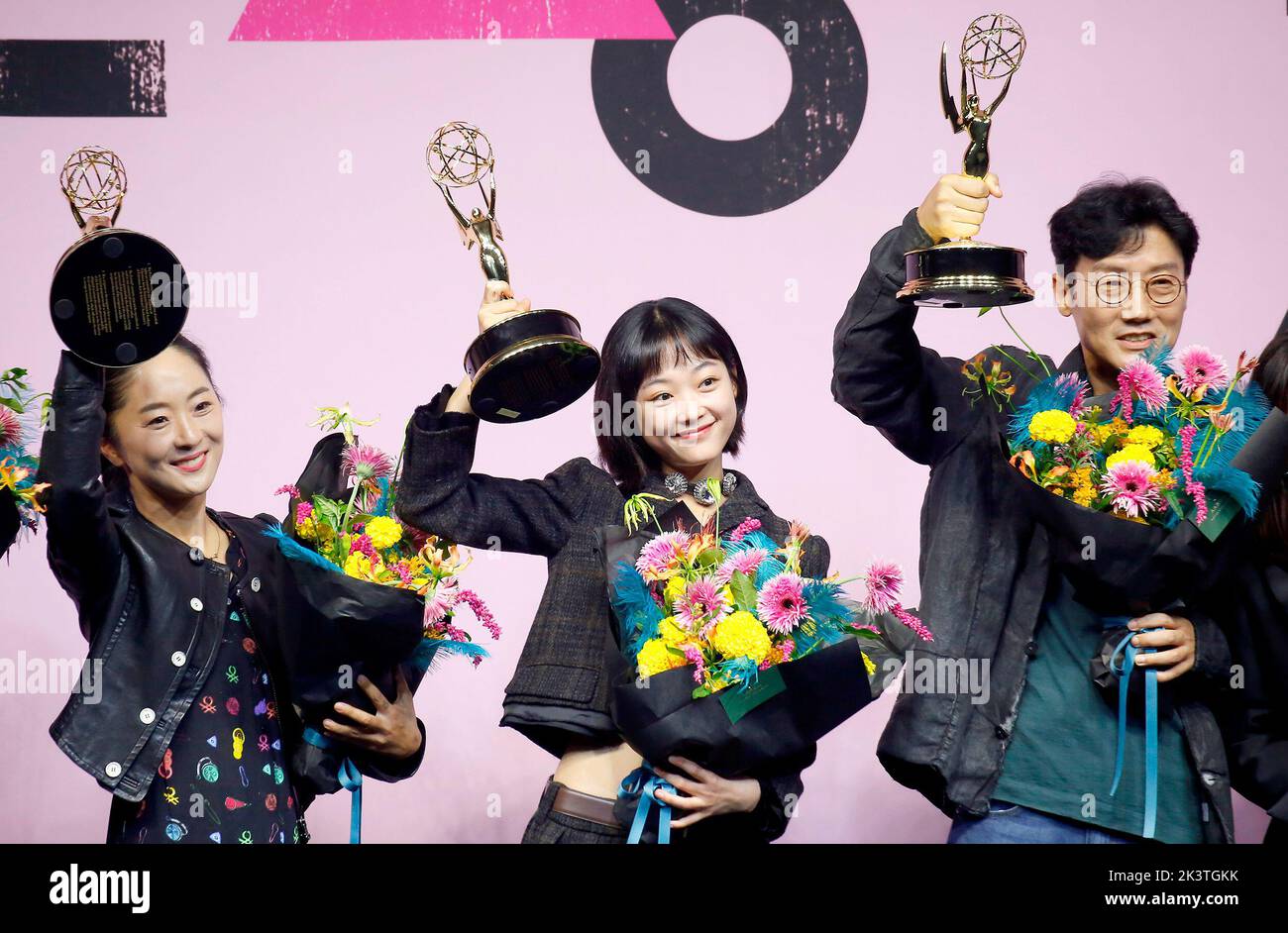 (L-R) Chae Kyoung-Sun, Lee Yoo-Mi and Hwang Dong-Hyuk, Sep 16, 2022 : Production designer Chae Kyoung-Sun of 'Squid Game', a winner of the Emmy award for the best production design for a narrative contemporary program, actress Lee Yoo-Mi, a winner of the Emmy award for outstanding guest actress in a drama series and director Hwang Dong-Hyuk pose at a press conference held to celebrate the Netflix series' six Emmy wins in Seoul, South Korea. The South Korean survival drama tv series created by Hwang Dong-Hyuk for Netflix bagged a total of six Emmy titles including best director for Hwang and be Stock Photo