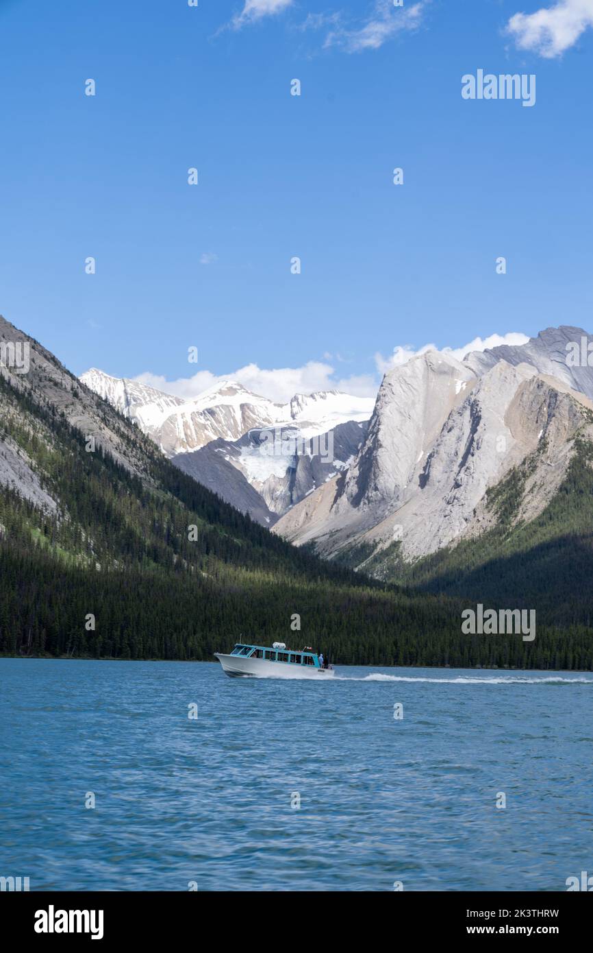 Boat on Maligne Lake, home of the famous Spirit Island, in Jasper National Park Stock Photo