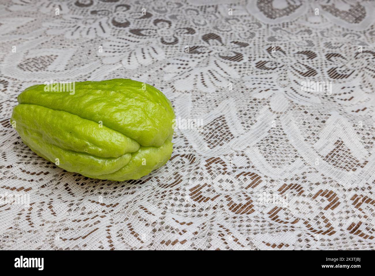 Brown Labu Rear view of chayote on a table with a fine brown knit tablecloth, also ...