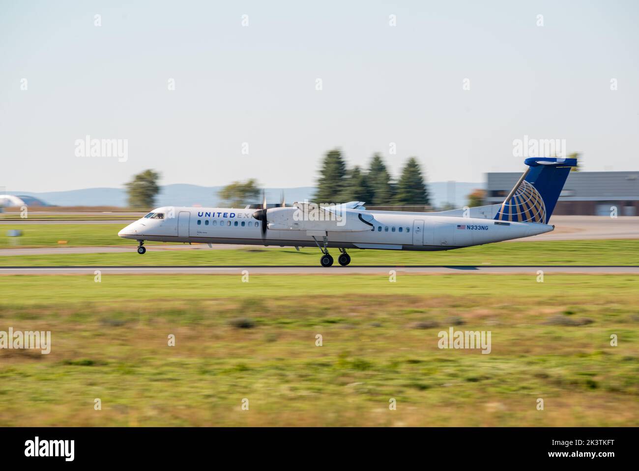 United Airlines propeller commercial aircraft landing at the Ottawa