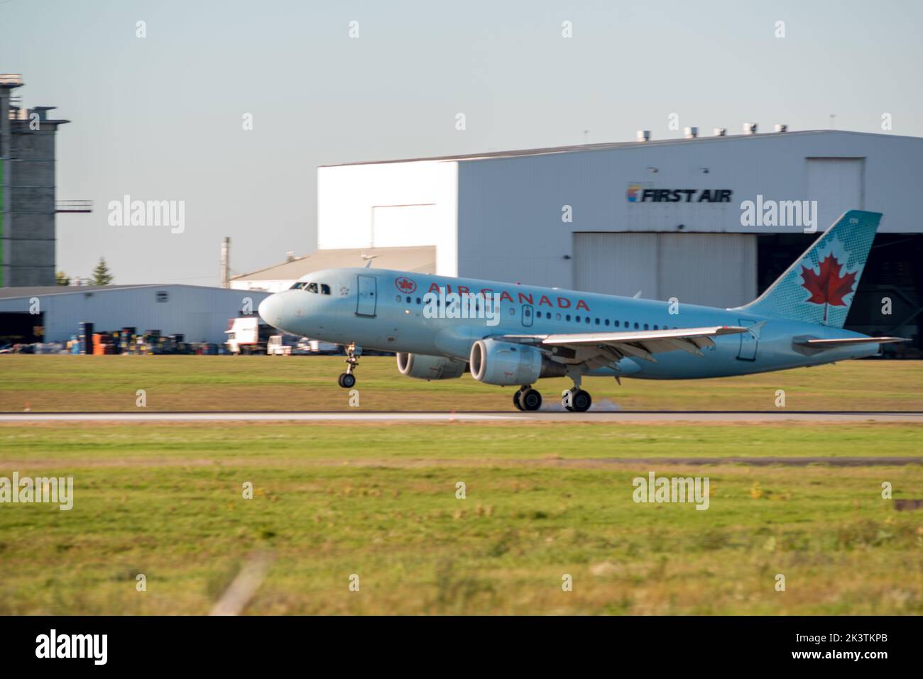 An Air Canada commercial jet aircraft landing at the Ottawa McDonald