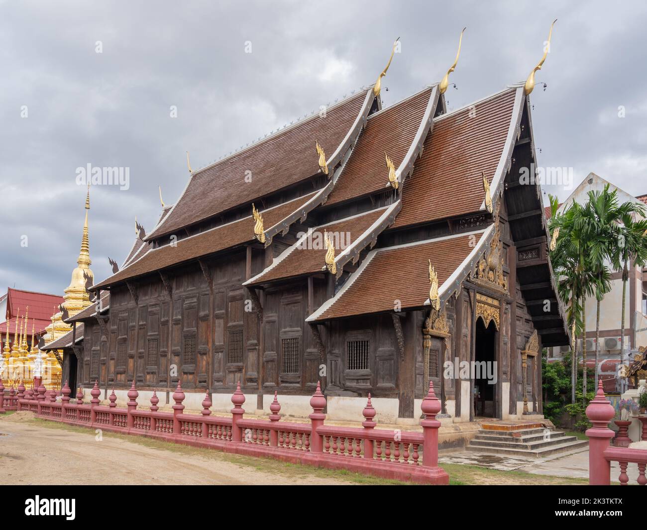 Side View Of Beautiful Ancient Wooden Wat Phan Tao Buddhist Temple With