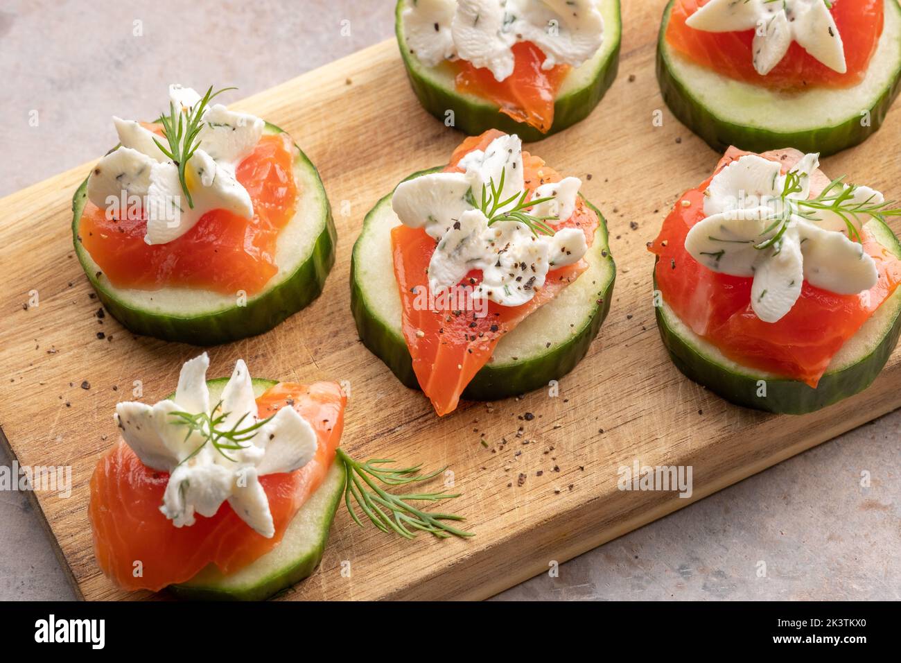 Cucumber bites with smoked salmon and cream cheese Stock Photo