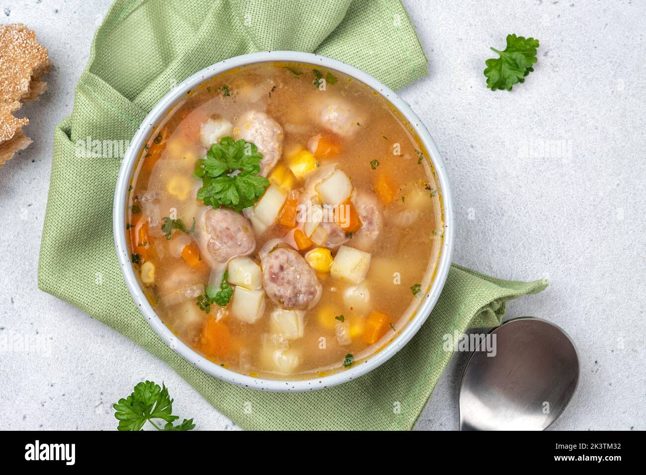 Chicken meatball soup with potato, carrot and corn Stock Photo