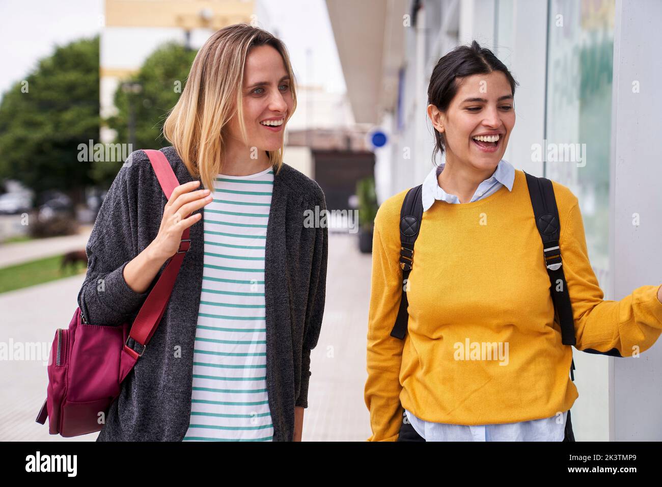 Photo of two friends window shopping outdoors Stock Photo