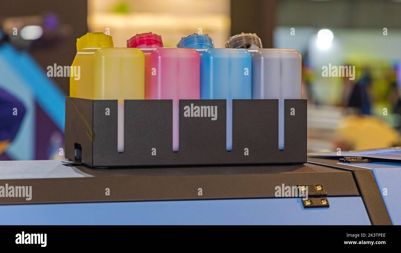 Four Large Cmyk Ink Bottles at Top of Printer Stock Photo - Alamy