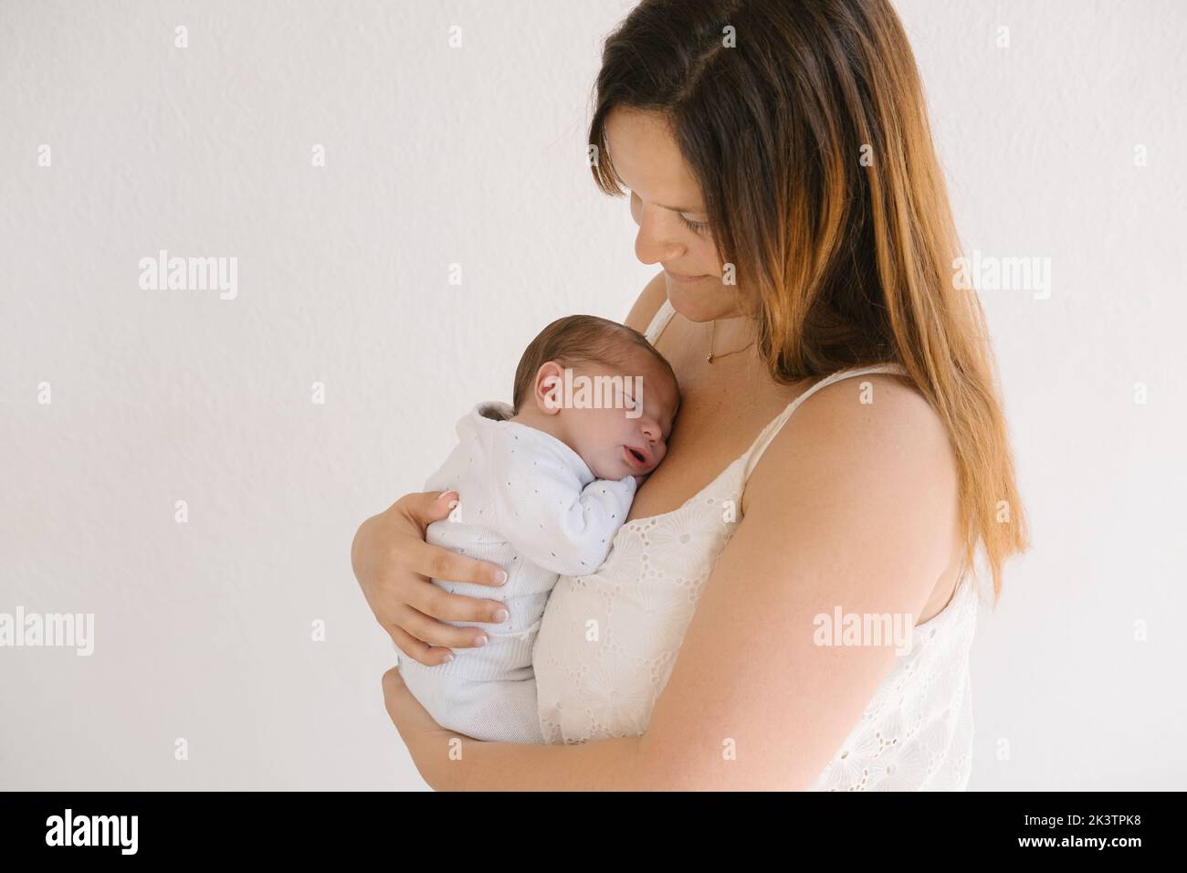 Baby sleeping on mom chest hi-res stock photography and images - Alamy