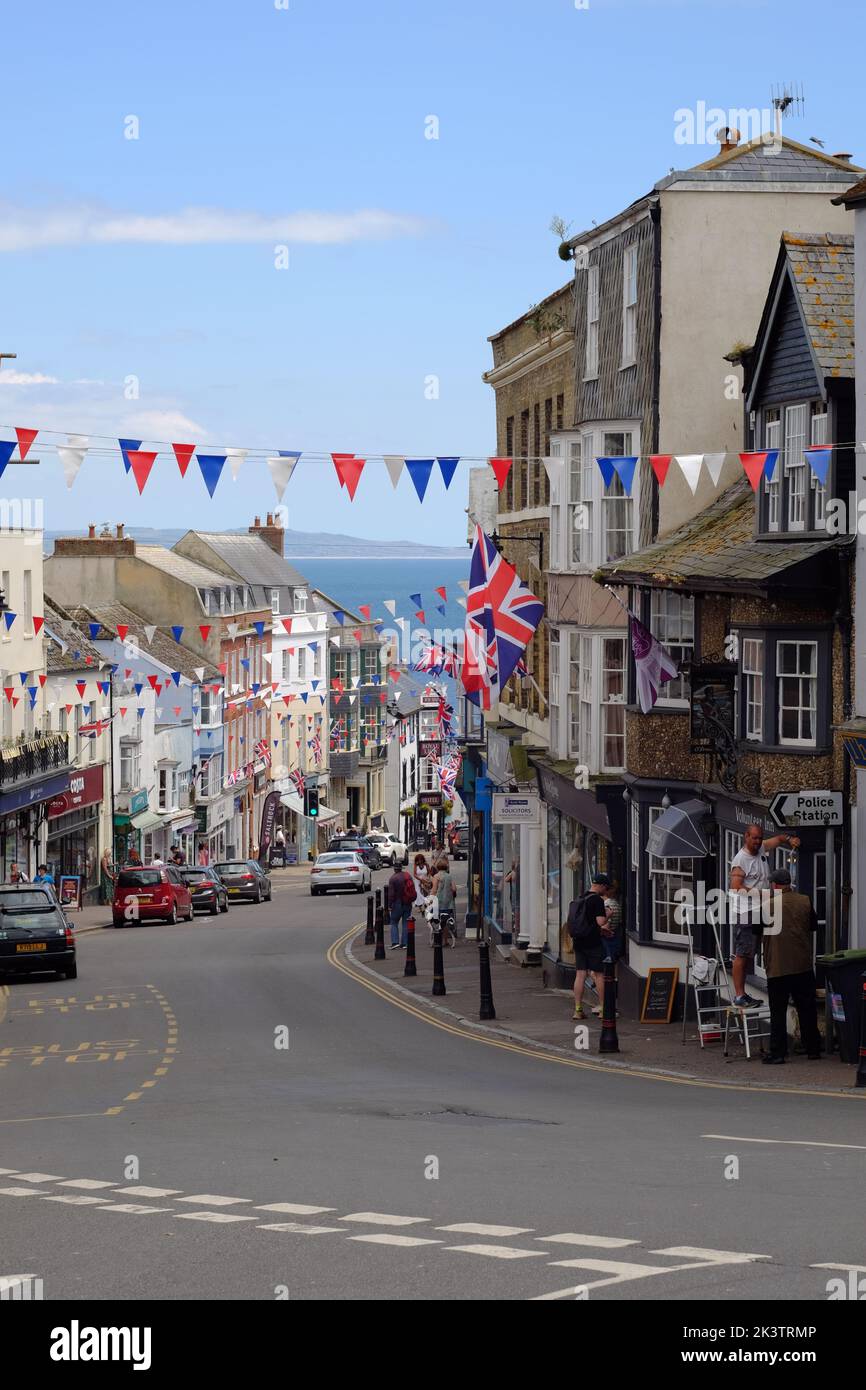 Lyme Regis, view down Broad Street towards Cobb Gate and the beach. Stock Photo