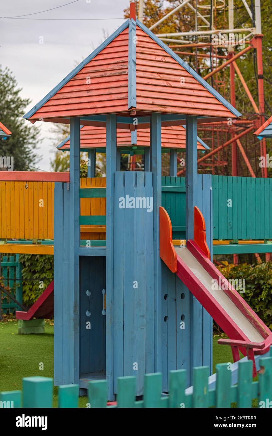 Slide in Wooden Castle Playground Area for Kids in Park Stock Photo