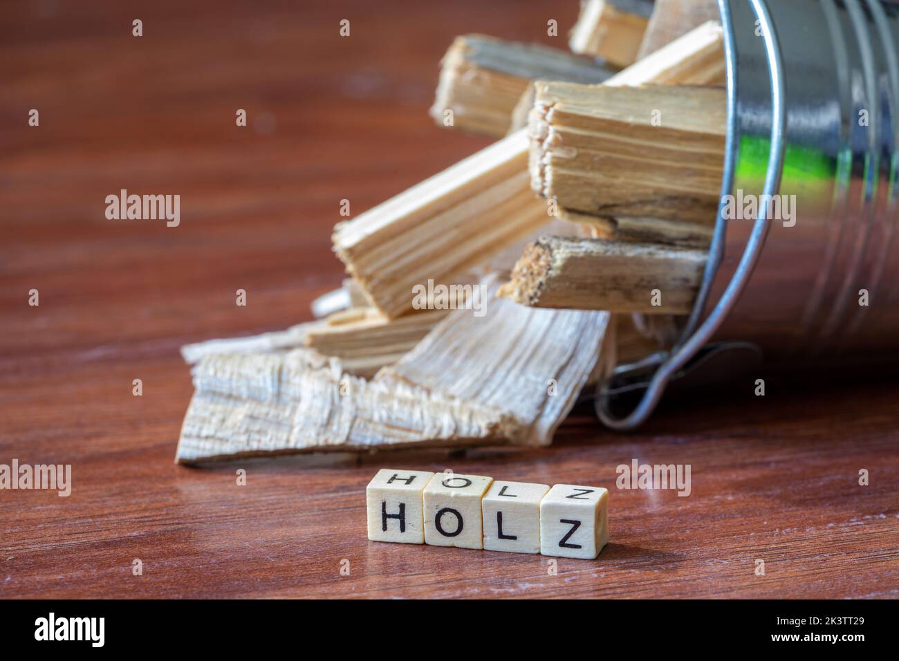 Zinc bucket with firewood and letter word wood Stock Photo Alamy
