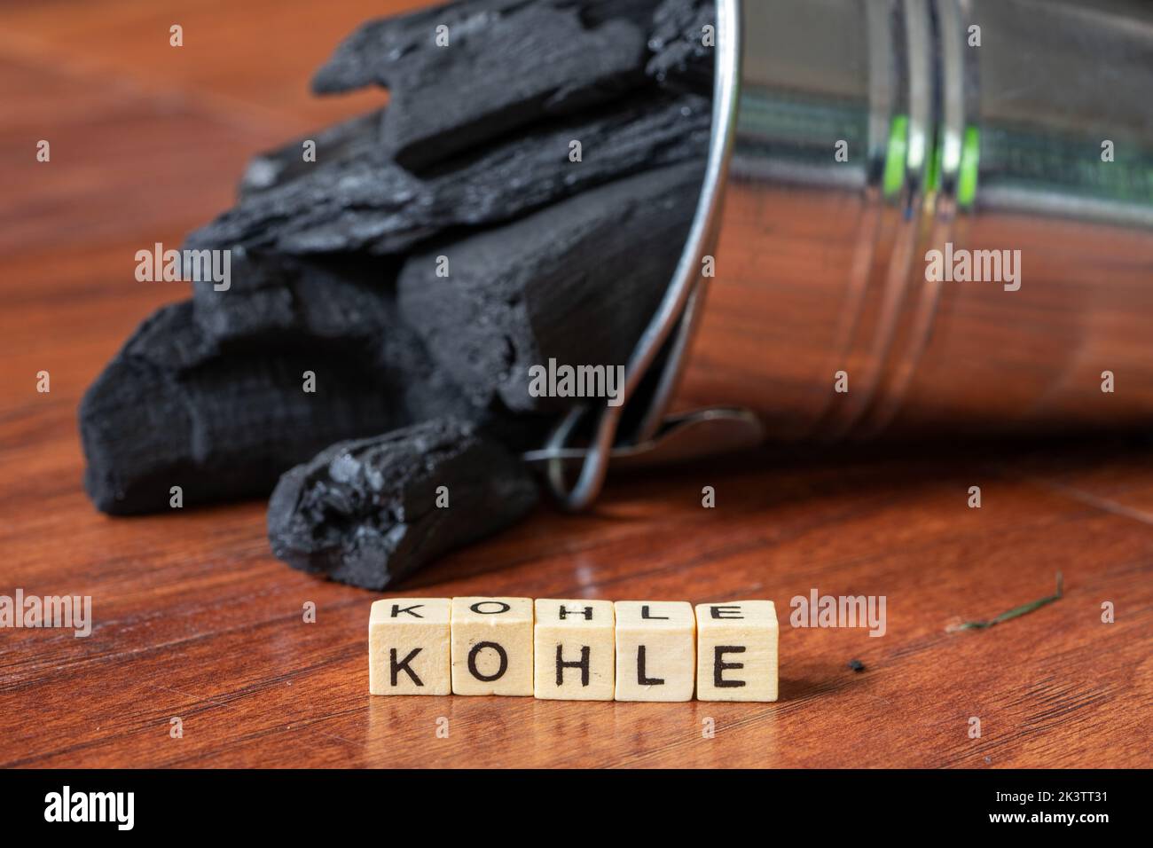 Zinc bucket with charcoal and letter word coal Stock Photo Alamy