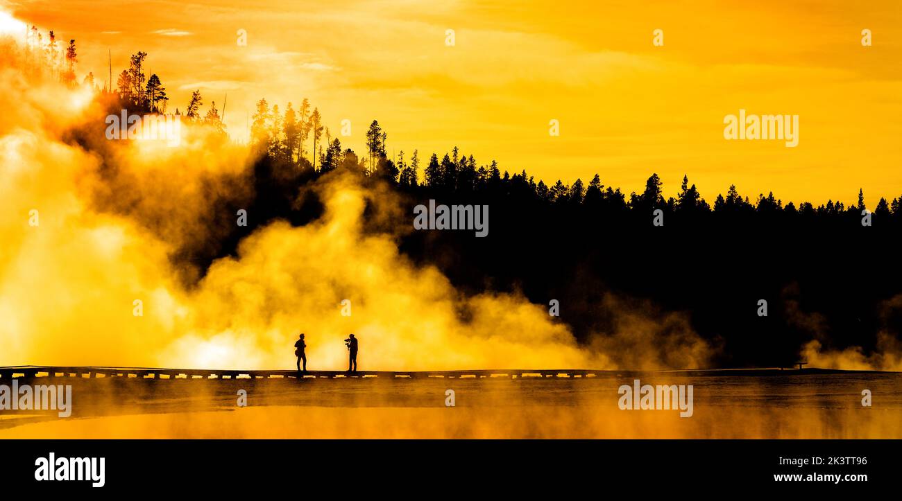 Silhouette of people photographing person steam geysers steam Stock Photo