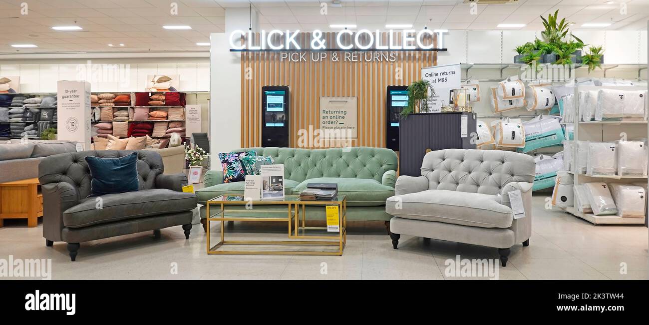 M&S customer Click & Collect pick up & returns facility with furniture display in large Marks and Spencer retail shopping business store in England UK Stock Photo