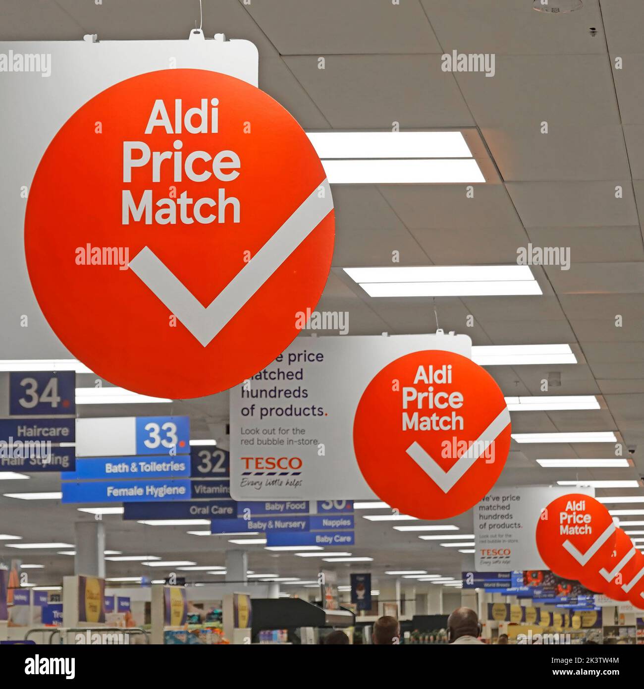 Tesco Supermarket interior shopping aisle repetitive round Aldi Price