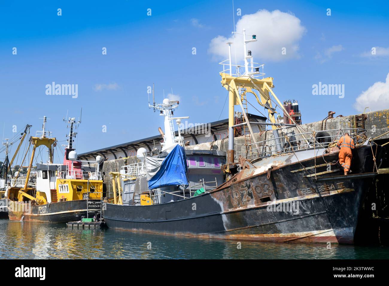 A trawler being repaired at Newlyn harbour in Cornwall, UK Stock Photo